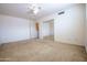 Well-lit bedroom with mirrored closet and door at 16068 W Edgemont Ave, Goodyear, AZ 85395