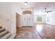 Tile entryway with double doors and hardwood floors at 16068 W Edgemont Ave, Goodyear, AZ 85395