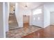 Bright entryway with double doors and staircase at 16068 W Edgemont Ave, Goodyear, AZ 85395