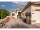 Landscaped front yard with drought-tolerant plants and a brick walkway at 16068 W Edgemont Ave, Goodyear, AZ 85395