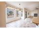 Bright eat-in kitchen with large windows and an island at 16068 W Edgemont Ave, Goodyear, AZ 85395