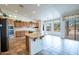 Kitchen boasts an island, ample cabinetry, and views of the backyard at 16068 W Edgemont Ave, Goodyear, AZ 85395