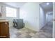 Laundry room with washer, dryer, and access to hallway at 16068 W Edgemont Ave, Goodyear, AZ 85395