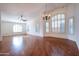 Large living room with hardwood floors, high ceilings, and a chandelier at 16068 W Edgemont Ave, Goodyear, AZ 85395