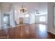 Spacious living room with hardwood floors and a ceiling fan at 16068 W Edgemont Ave, Goodyear, AZ 85395