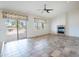 Bright living room with fireplace and sliding glass doors at 16068 W Edgemont Ave, Goodyear, AZ 85395