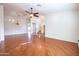 Open living room with hardwood floors, high ceilings, and chandelier at 16068 W Edgemont Ave, Goodyear, AZ 85395