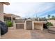 Stainless steel outdoor kitchen with built-in grill at 16068 W Edgemont Ave, Goodyear, AZ 85395