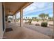 Covered patio with golf course view and ceiling fan at 16068 W Edgemont Ave, Goodyear, AZ 85395