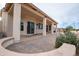 Covered patio with sitting area and desert landscaping at 16068 W Edgemont Ave, Goodyear, AZ 85395