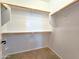 Large walk-in closet with built-in shelving and plenty of hanging space at 1627 S 104Th Ln, Tolleson, AZ 85353