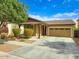 Attractive single-story home with a two-car garage and desert landscaping at 1627 S 104Th Ln, Tolleson, AZ 85353