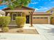 Charming single-story home with a two-car garage and landscaped front yard at 1627 S 104Th Ln, Tolleson, AZ 85353