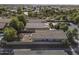 Aerial view of a home with a fenced backyard, patio, and surrounding neighborhood at 3018 N Regal Ct, Casa Grande, AZ 85122