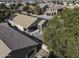 Aerial view of a home's backyard with solar panels, a covered patio, and trees at 3018 N Regal Ct, Casa Grande, AZ 85122