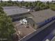 Aerial view of the home's backyard, featuring a covered patio, landscaping, and a fence at 3018 N Regal Ct, Casa Grande, AZ 85122