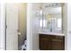 Half bath with tiled floors, wooden vanity and toilet at 3018 N Regal Ct, Casa Grande, AZ 85122