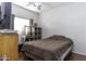 Bedroom with dark wood furniture and wooden shelving units at 3018 N Regal Ct, Casa Grande, AZ 85122