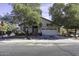 Inviting single-story home exterior with a two-car garage and lush landscaping at 3018 N Regal Ct, Casa Grande, AZ 85122