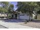 Charming single-story home with a two-car garage and landscaped front yard at 3018 N Regal Ct, Casa Grande, AZ 85122