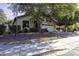 Attractive single-story residence with a two-car garage and mature trees at 3018 N Regal Ct, Casa Grande, AZ 85122