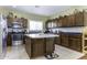 Modern kitchen featuring wood cabinetry, stainless steel appliances, and a center island at 3018 N Regal Ct, Casa Grande, AZ 85122