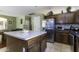 Kitchen with island, stainless steel appliances, and wood cabinets at 3018 N Regal Ct, Casa Grande, AZ 85122