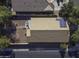 An aerial view of the home's rooftop, featuring solar panels and a gravel backyard at 3018 N Regal Ct, Casa Grande, AZ 85122