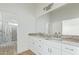 Modern bathroom featuring white cabinets, granite countertop, and stylish fixtures at 30432 N 235Th Ln, Wittmann, AZ 85361