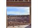 View of the desert landscape with mountains in the distance from a home under construction at 30432 N 235Th Ln, Wittmann, AZ 85361