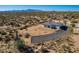 Aerial view of a one-story house with desert landscaping and mountain views at 30605 N 172Nd St, Rio Verde, AZ 85263