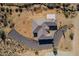 Aerial view of a house with a distinctive roofline and rock landscaping at 30605 N 172Nd St, Rio Verde, AZ 85263