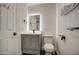 Bathroom with gray vanity, single sink, toilet, and black hardware at 3335 E San Angelo Ave, Gilbert, AZ 85234