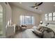Relaxing bedroom with a view of the pool and modern furnishings at 3335 E San Angelo Ave, Gilbert, AZ 85234