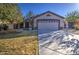 Single-story residence with a two-car garage, front yard landscaping, and a cozy atmosphere at 3335 E San Angelo Ave, Gilbert, AZ 85234