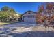 Attractive single-story home featuring a two-car garage and a well-maintained front yard at 3335 E San Angelo Ave, Gilbert, AZ 85234