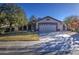 Inviting single-story home with a two-car garage, landscaping, and a welcoming front yard at 3335 E San Angelo Ave, Gilbert, AZ 85234