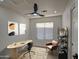 Modern home office with stylish furniture, wood floors, and ample natural light at 3335 E San Angelo Ave, Gilbert, AZ 85234