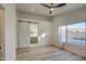 Spacious main bedroom with ensuite bathroom access through a sliding barn door at 3335 E San Angelo Ave, Gilbert, AZ 85234