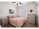 Bedroom with soft pink bedding and neutral decor at 3651 E Crest Ln, Phoenix, AZ 85050