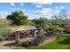 Outdoor community space with covered seating area and beautiful landscaping at 3651 E Crest Ln, Phoenix, AZ 85050