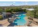 Expansive community pool with lounge chairs, umbrellas, and a hot tub at 3651 E Crest Ln, Phoenix, AZ 85050