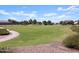 Open field in the community park ideal for recreation at 37014 W Prado St, Maricopa, AZ 85138