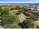 Aerial view of community park with playground, sports fields, and homes at 37374 W San Clemente St, Maricopa, AZ 85138