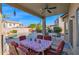 Covered patio with outdoor dining area and pool in the backyard at 4208 E Tether Trl, Phoenix, AZ 85050