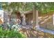 Inviting front entry with arched columns, shaded porch, and desert landscaping at 4208 E Tether Trl, Phoenix, AZ 85050