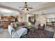 Open concept living room with view of the kitchen, staircase, and front door at 4208 E Tether Trl, Phoenix, AZ 85050