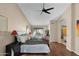 Large main bedroom with ceiling fan, wood floors, and attached bathroom at 4208 E Tether Trl, Phoenix, AZ 85050
