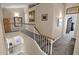 Upstairs hallway with a view to the floor below and door to the bedroom at 4208 E Tether Trl, Phoenix, AZ 85050