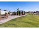 Neighborhood park with a covered picnic area, playground, and grassy area at 4883 W Hunter Trl, San Tan Valley, AZ 85144